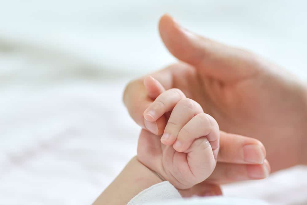 New Born IVF Baby Holding Hands